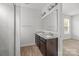 Bathroom features double vanity, framed mirror, and tiled shower at 2821 Shamrock Dr, Charlotte, NC 28205