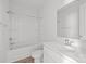 Bright bathroom features a shower/tub combo and large mirror above the single sink at 2821 Shamrock Dr, Charlotte, NC 28205