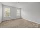 Bright bedroom with carpeted floor and windows for natural light at 2821 Shamrock Dr, Charlotte, NC 28205
