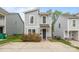 Charming two-story home featuring a gray siding, stylish windows, and a well-manicured front yard at 2821 Shamrock Dr, Charlotte, NC 28205