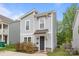 Charming two-story home with gray siding and a covered front entry at 2821 Shamrock Dr, Charlotte, NC 28205