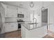 Bright kitchen featuring stainless appliances, granite countertops and an island with bar seating at 2821 Shamrock Dr, Charlotte, NC 28205