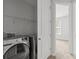 Laundry closet with modern washer and dryer at 2821 Shamrock Dr, Charlotte, NC 28205