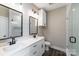 Modern bathroom showcases a double sink vanity, sleek mirrors, and a glass enclosed shower at 28655-A Nc Hwy 73 Hwy, Albemarle, NC 28001