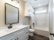 Well-lit bathroom features a vanity with quartz countertop and a shower with tub at 28655-A Nc Hwy 73 Hwy, Albemarle, NC 28001