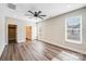 Spacious bedroom features wood floors, a ceiling fan, and a walk-in closet for ample storage at 28655-A Nc Hwy 73 Hwy, Albemarle, NC 28001