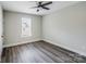 Bright bedroom features a ceiling fan and natural light from the window at 28655-A Nc Hwy 73 Hwy, Albemarle, NC 28001