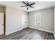 Neutral bedroom has wood floors, a ceiling fan, and a double-door closet for easy storage at 28655-A Nc Hwy 73 Hwy, Albemarle, NC 28001