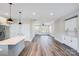 Spacious open concept living area with modern kitchen, wood floors, and plenty of natural light at 28655-A Nc Hwy 73 Hwy, Albemarle, NC 28001