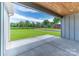 Covered patio offers outdoor living with a view of the spacious green backyard at 28655-A Nc Hwy 73 Hwy, Albemarle, NC 28001