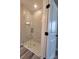 Contemporary shower features marble-look tile, glass door, and recessed niche at 28655-A Nc Hwy 73 Hwy, Albemarle, NC 28001