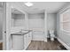 Bathroom with tub-shower, granite vanity, and a window, creating a bright and functional space at 330 Clover St, Mooresville, NC 28115