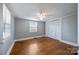 Cozy bedroom with hardwood floors, a ceiling fan, and a closet, providing a comfortable retreat at 330 Clover St, Mooresville, NC 28115