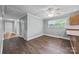 Dining room features wood laminate flooring, neutral walls, and a ceiling fan, creating a welcoming space for dining at 330 Clover St, Mooresville, NC 28115