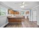 Open kitchen layout with wood cabinets, and breakfast bar, offering a functional space for cooking and entertaining at 330 Clover St, Mooresville, NC 28115
