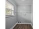 Functional laundry room with a window and a shelf, providing a practical space for laundry tasks at 330 Clover St, Mooresville, NC 28115