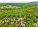 A beautiful aerial view of a residential area, showcasing lush trees and well-maintained homes at 3509 Seminole Dr, Maiden, NC 28650