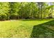 Serene backyard with lush greenery, mature trees, and ample space for recreation and relaxation at 3509 Seminole Dr, Maiden, NC 28650