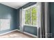 Cozy room featuring neutral walls, a window with natural light, and plush carpeting at 3509 Seminole Dr, Maiden, NC 28650