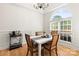 Bright dining room with hardwood floors, chandelier, and large arched window at 3509 Seminole Dr, Maiden, NC 28650