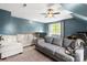 Spacious living room with ceiling fan, two couches, and ample natural light at 3509 Seminole Dr, Maiden, NC 28650