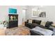 Bright living room features a large sofa, an aquarium, and an open view to the kitchen at 3509 Seminole Dr, Maiden, NC 28650