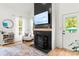 Modern living room with a fireplace, stylish decor, and ample natural light at 3509 Seminole Dr, Maiden, NC 28650