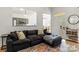 Inviting living room with a large sofa, open layout, and a view to the dining area at 3509 Seminole Dr, Maiden, NC 28650
