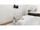 Bright bedroom with hardwood floors, wall-mounted television, and dark dresser at 3509 Seminole Dr, Maiden, NC 28650
