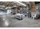 Spacious unfinished basement with concrete floors and cinder block walls, offering potential for customization and storage at 378 Shoreline Dr, New London, NC 28127