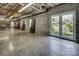 Large basement featuring double doors leading to the exterior and offering ample space for storage and hobbies at 378 Shoreline Dr, New London, NC 28127