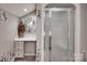 Functional bathroom featuring a vanity with storage and a glass-enclosed shower at 378 Shoreline Dr, New London, NC 28127
