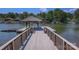 Scenic view from the dock with a charming covered boat slip on a tranquil lake at 378 Shoreline Dr, New London, NC 28127