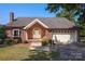 Lovely brick home featuring a two-car garage, bay window, and manicured front lawn at 378 Shoreline Dr, New London, NC 28127