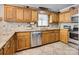 Well-equipped kitchen featuring stainless steel appliances and stylish tile backsplash at 378 Shoreline Dr, New London, NC 28127