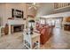 Spacious living room showcasing a brick fireplace, stylish decor, and comfortable leather couches at 378 Shoreline Dr, New London, NC 28127