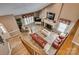 Open living room featuring vaulted ceiling, fireplace, and tile flooring from aerial view at 378 Shoreline Dr, New London, NC 28127