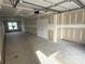 A well-lit two-car garage showcasing storage space and potential for customization at 433 Blairhill Rd # 08, Charlotte, NC 28217