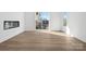 Inviting living room with neutral walls, hardwood flooring, a modern fireplace and a sliding door that offers an exit to the outdoors at 433 Blairhill Rd # 08, Charlotte, NC 28217