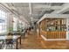 Spacious market area features tables, natural light from large windows, and several vendor areas at 433 Blairhill Rd # 08, Charlotte, NC 28217