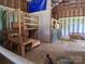 Well-maintained barn interior featuring wooden structures and ample space for livestock or storage at 4330 Goodman Lake Rd, Salisbury, NC 28146