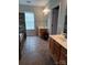 Modern bathroom with stone accent wall, double sink vanity, tile flooring and framed mirrors at 4330 Goodman Lake Rd, Salisbury, NC 28146