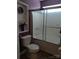 This bathroom features an easy to clean toilet and a shower and bathtub combo with glass doors at 4330 Goodman Lake Rd, Salisbury, NC 28146