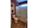 Cozy bathroom with toilet and glass-enclosed shower and tile floor at 4330 Goodman Lake Rd, Salisbury, NC 28146