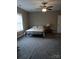 Comfortable bedroom with ceiling fan, neutral walls, and plush carpeting at 4330 Goodman Lake Rd, Salisbury, NC 28146