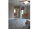 View of a carpeted bedroom with neutral walls that leads to the ensuite bathroom featuring a tub at 4330 Goodman Lake Rd, Salisbury, NC 28146