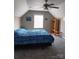 Comfortable bedroom with a large bed, ceiling fan, window, and a bookshelf, creating a cozy atmosphere at 4330 Goodman Lake Rd, Salisbury, NC 28146