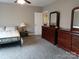 Comfortable bedroom with bed and dresser at 4330 Goodman Lake Rd, Salisbury, NC 28146