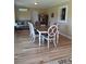 Formal dining area features hardwood floors, stylish chairs, modern table and a view of the open-concept layout at 4330 Goodman Lake Rd, Salisbury, NC 28146