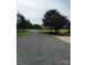 Long gravel driveway leading to the house, surrounded by lush greenery at 4330 Goodman Lake Rd, Salisbury, NC 28146